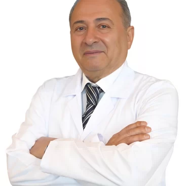 Portrait of Prof. Dr. Mustafa Taşkın, a General Surgery Specialist, in a professional medical environment.

