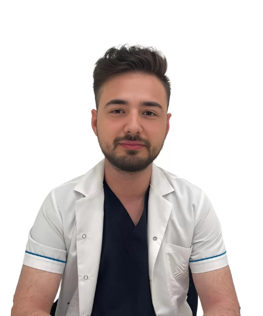 Portrait of Hasan Nur, a Hair Transplant Specialist, standing in a clinical environment.