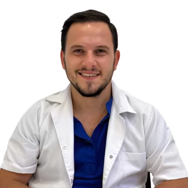 Portrait of Kadir Ban, a Hair Transplant Specialist at Estetikland-Avrasya Hospital, standing in a professional medical environment.