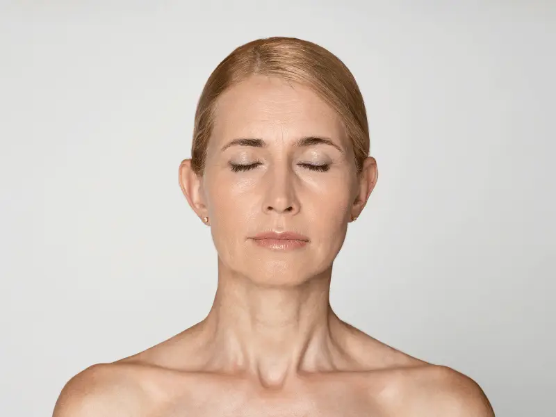 Matched-angle assessment photography of the chin and neck at Vivid Clinic