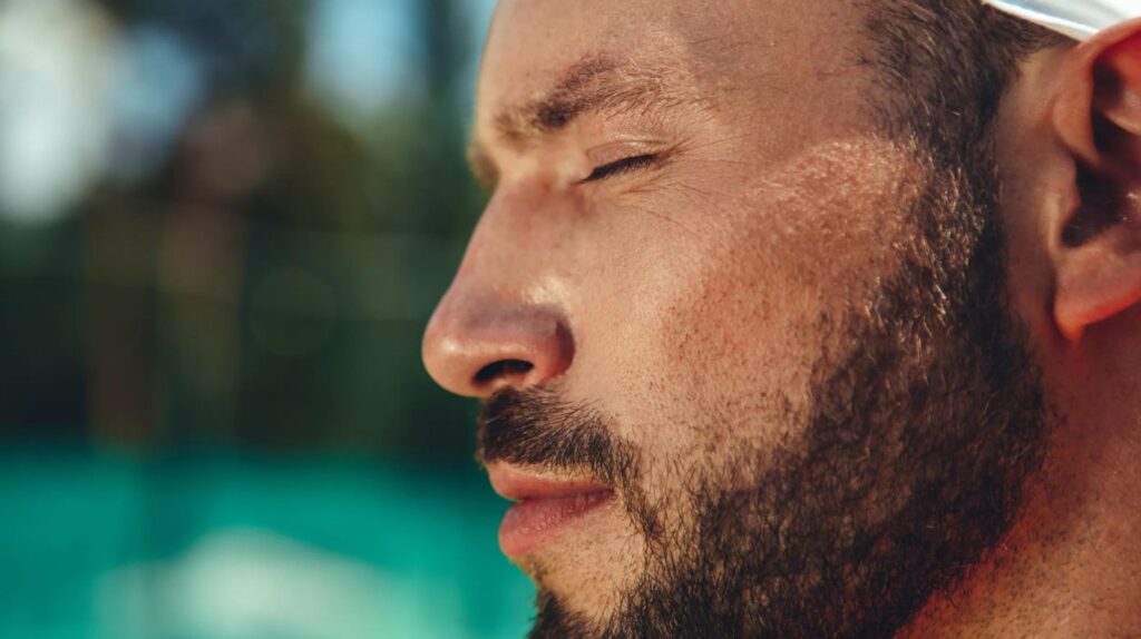 Man with a straight, balanced nose, displaying sharp, masculine facial features.