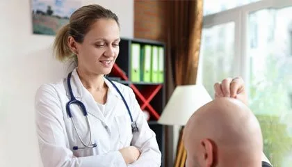 Surgeon performing an FUE hair transplant, the technique most often linked to Elon Musk's hair restoration