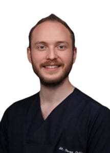 Dt. Caner Çetin - Aesthetic Dentist at Vivid Clinic specializing in digital dentistry, porcelain veneers, and smile design treatments