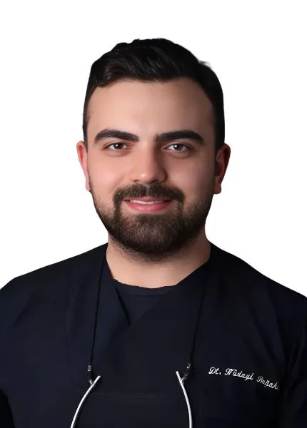 Dt. Hüdayi Boğahan - Aesthetic Dentist at Vivid Clinic, specializing in prosthetic dental treatments, smile design, and zirconium applications